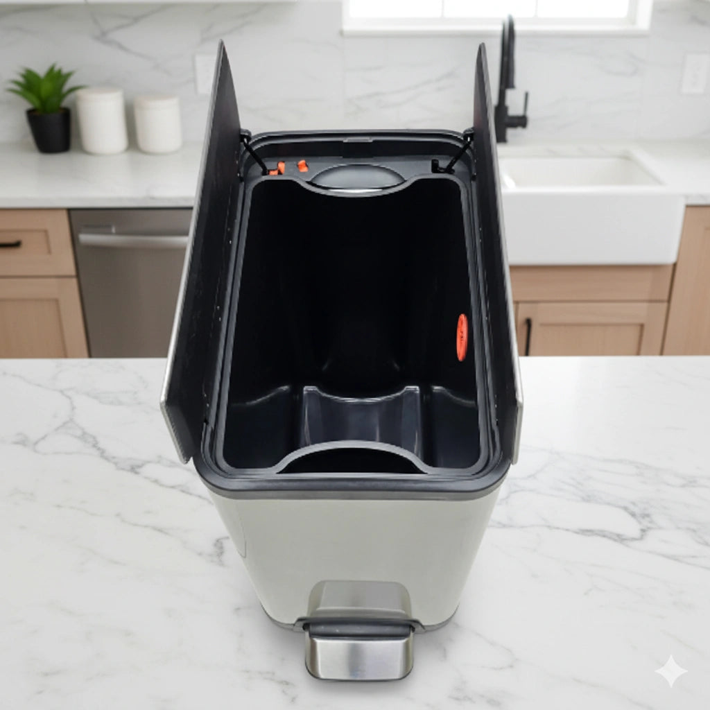 Kitchen trash bin with open lid on a marble countertop