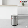 Stainless steel trash bin with KBazar logo in a kitchen setting