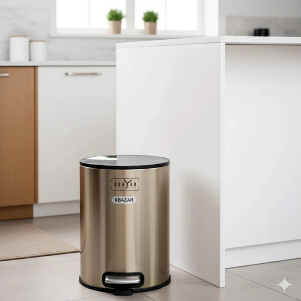 Gold trash can with black lid in a kitchen setting