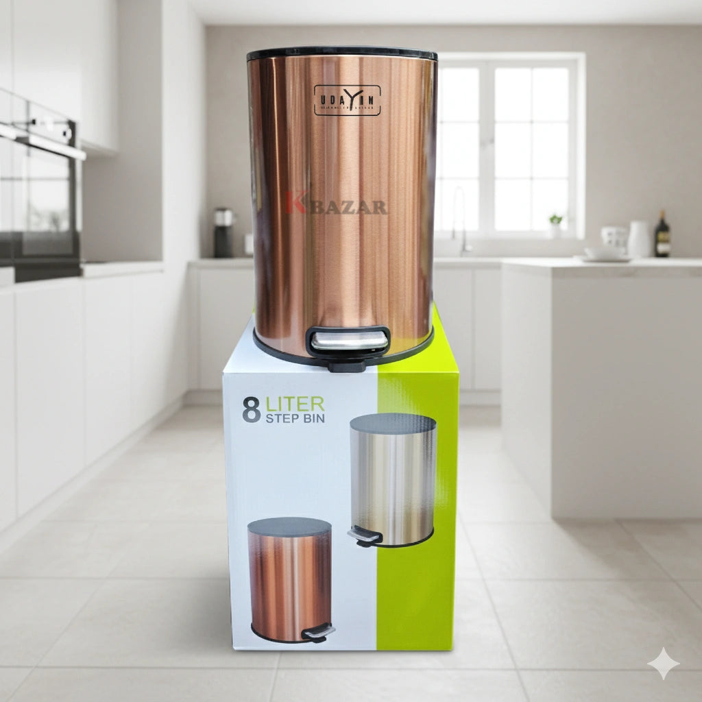 Copper-colored step bin with a box labeled '8 Liter Step Bin' in a kitchen setting.