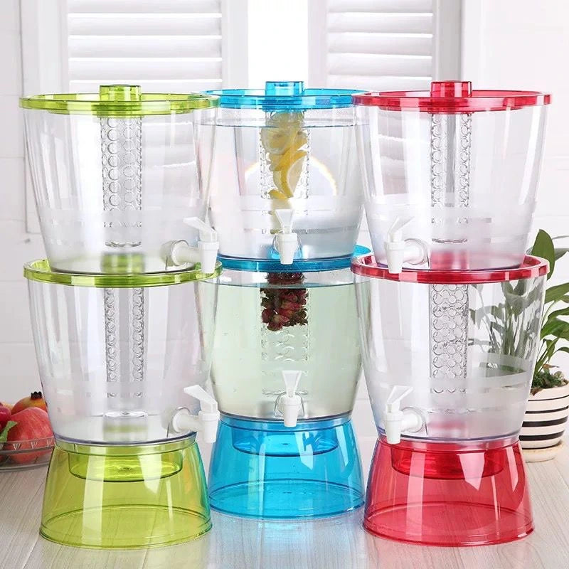 Three colorful juice dispensers on a wooden surface with a white background.