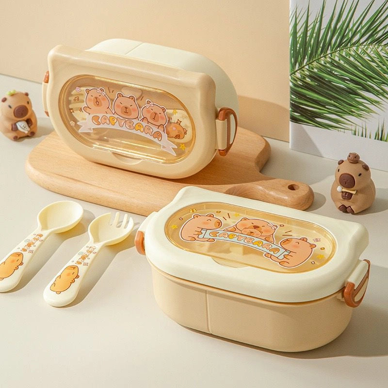 Children's lunch box set with cartoon design on a light background