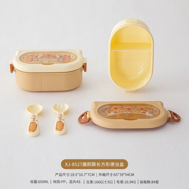 Children's lunch box set with compartments and accessories on a white background