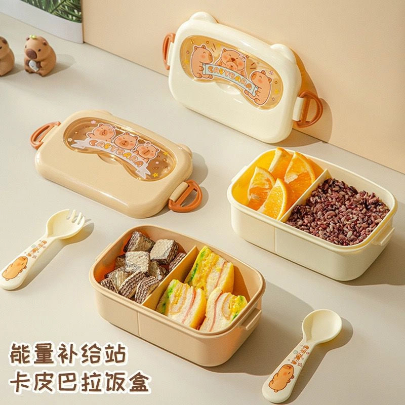 Set of bento boxes with food compartments on a light surface