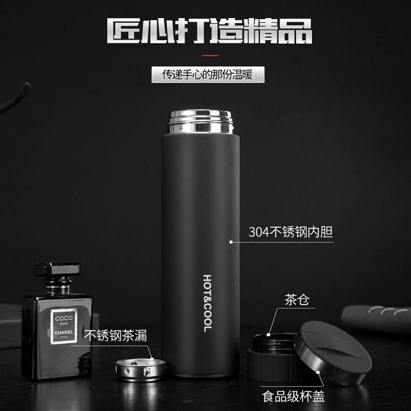Black thermos bottle with silver accents on a dark background, featuring text and branding.